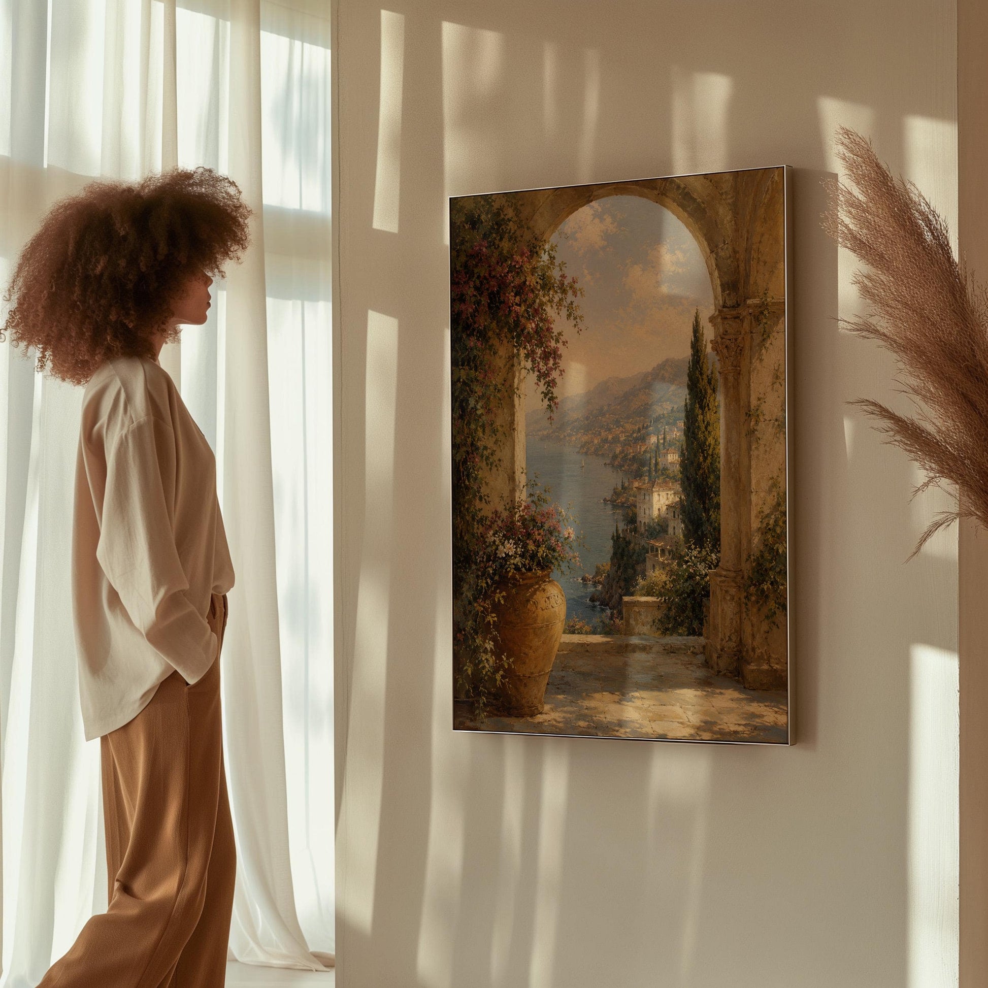 Mediterranean coastline seen through an old stone arch, canvas wall art on a quiet wall in a considered interior