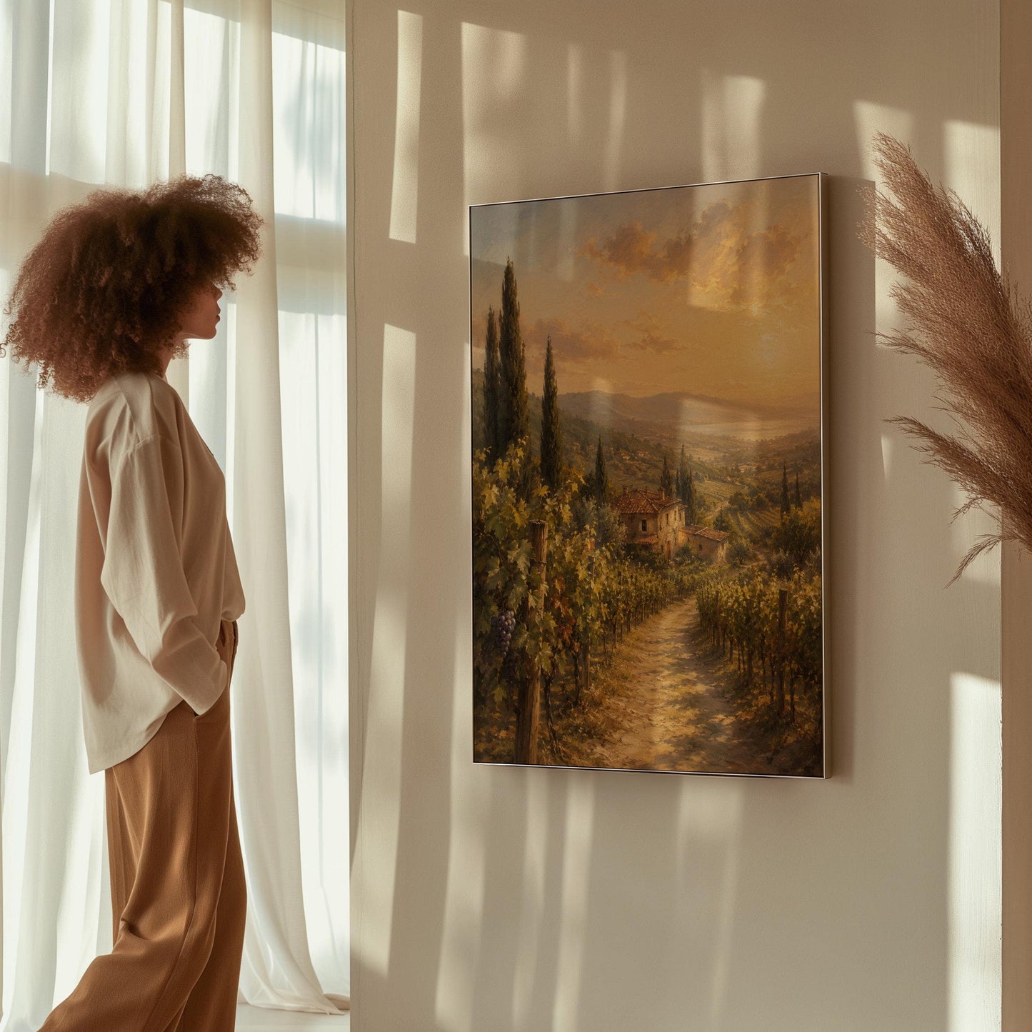 Tuscan vineyard at sunset with a stone farmhouse, canvas wall art presented in a light, minimal room