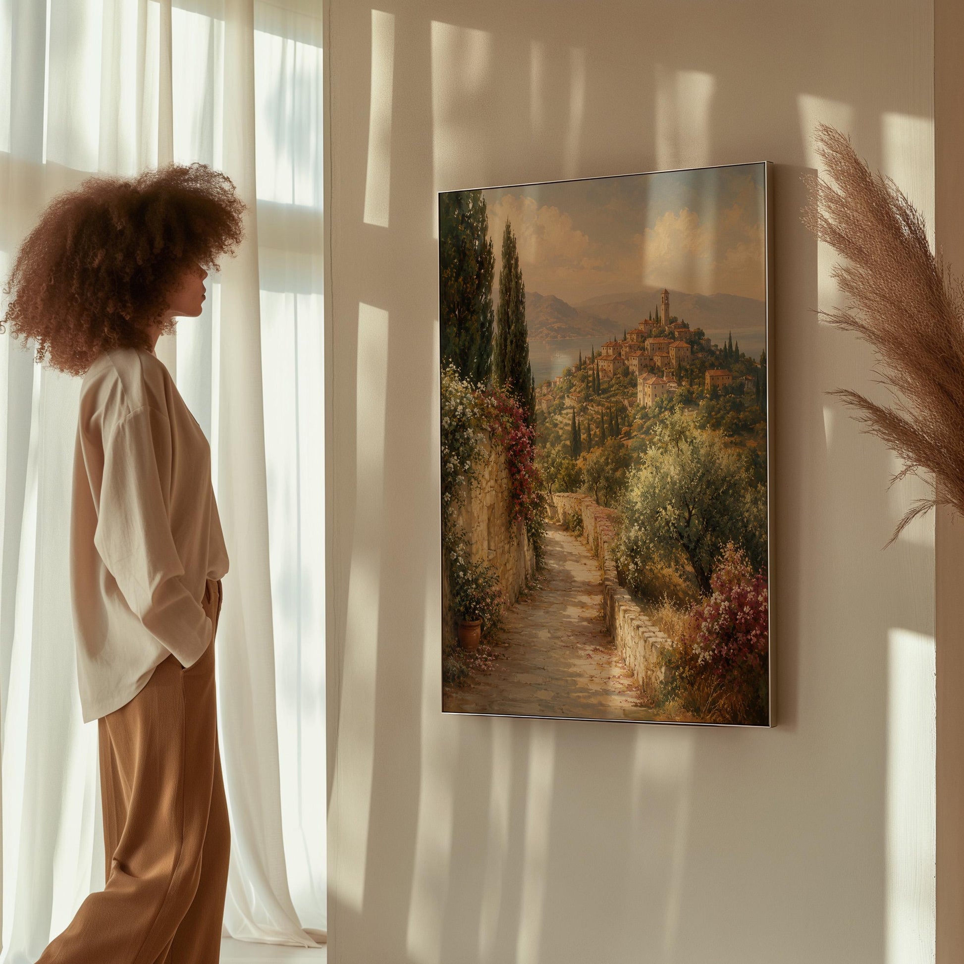 Stone path leading to an Italian hilltop village, canvas print presented in a light, minimal room
