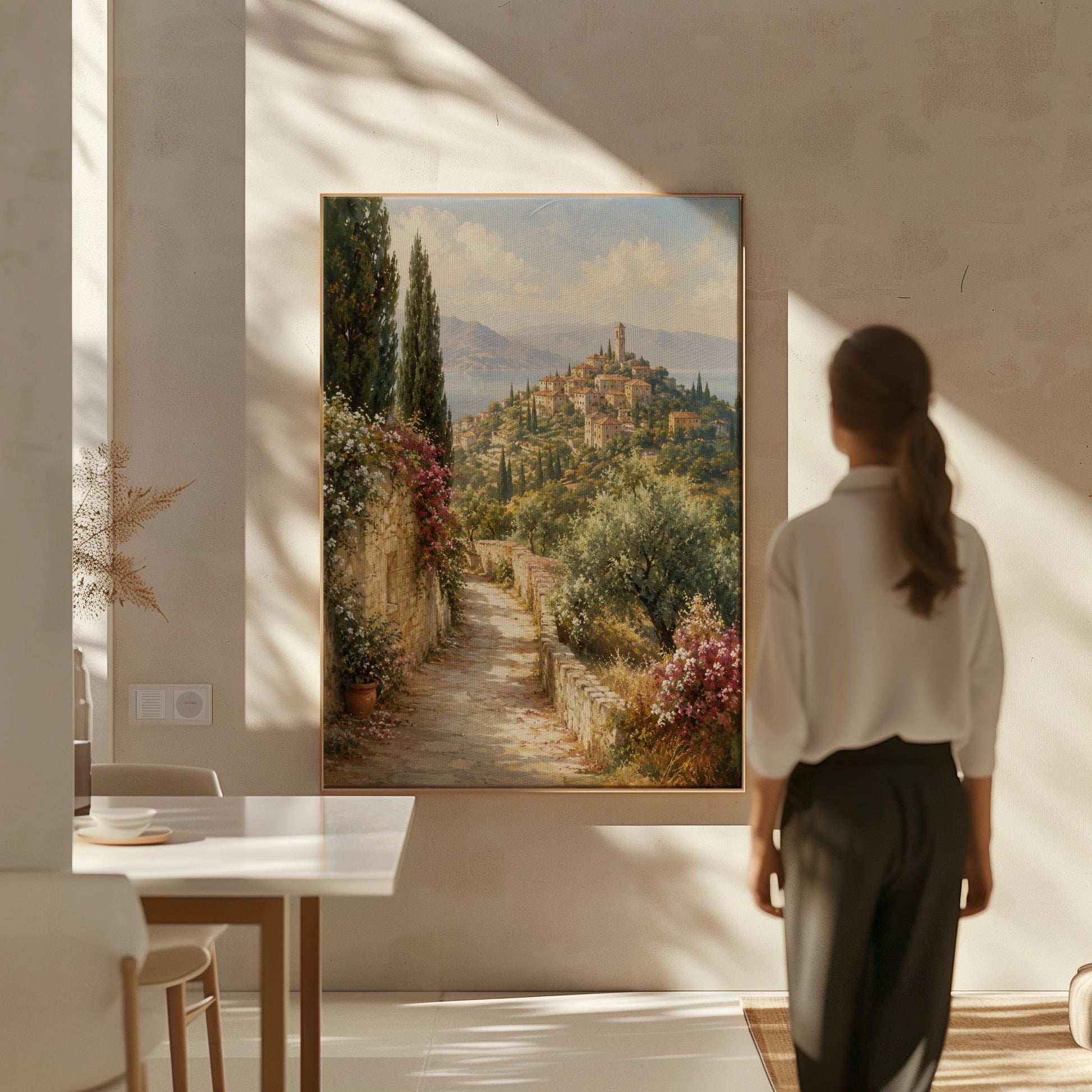 Stone path leading to an Italian hilltop village, canvas wall art styled against a soft white wall