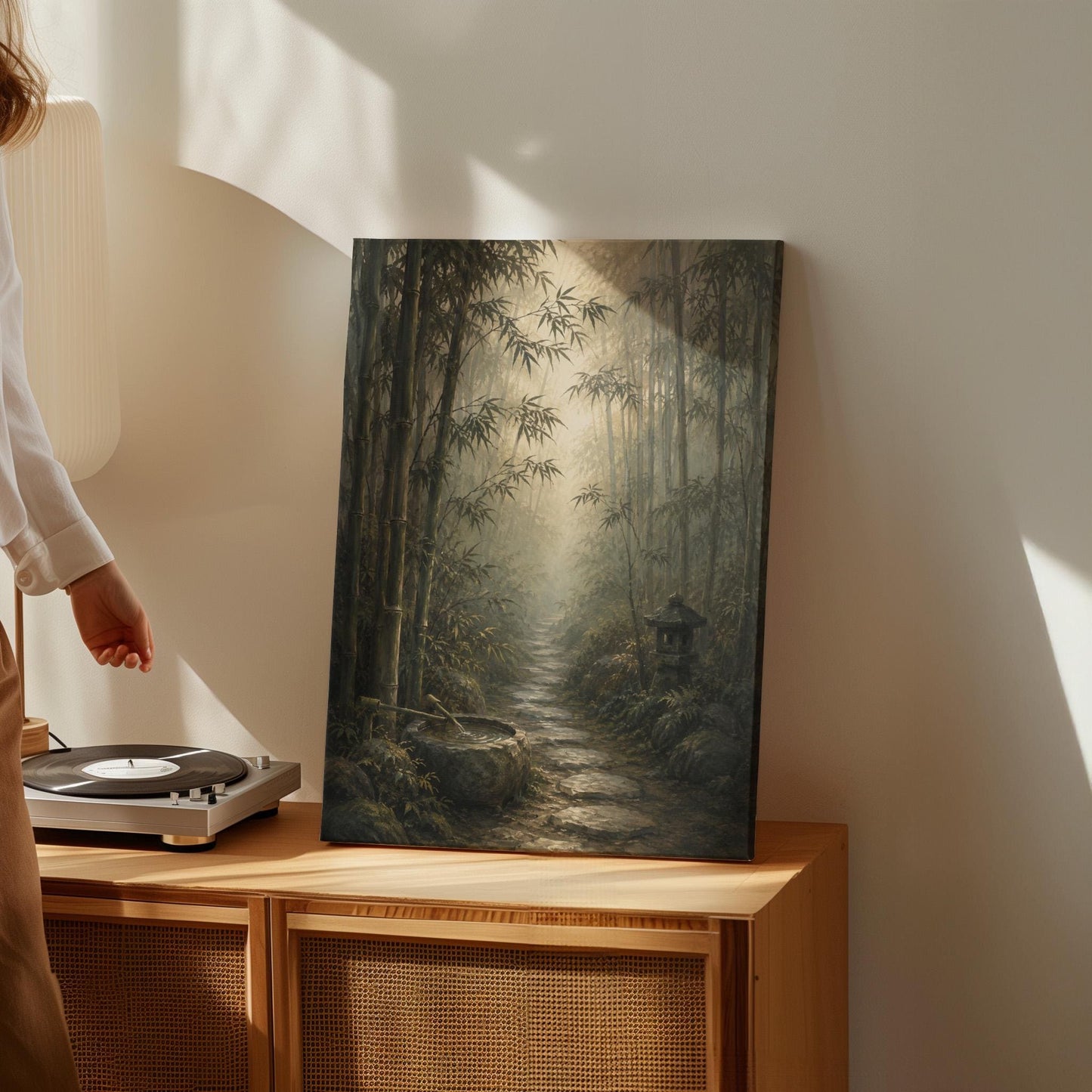 Stone path through a misty bamboo forest with a water basin, canvas print shown in a sunlit, contemporary room