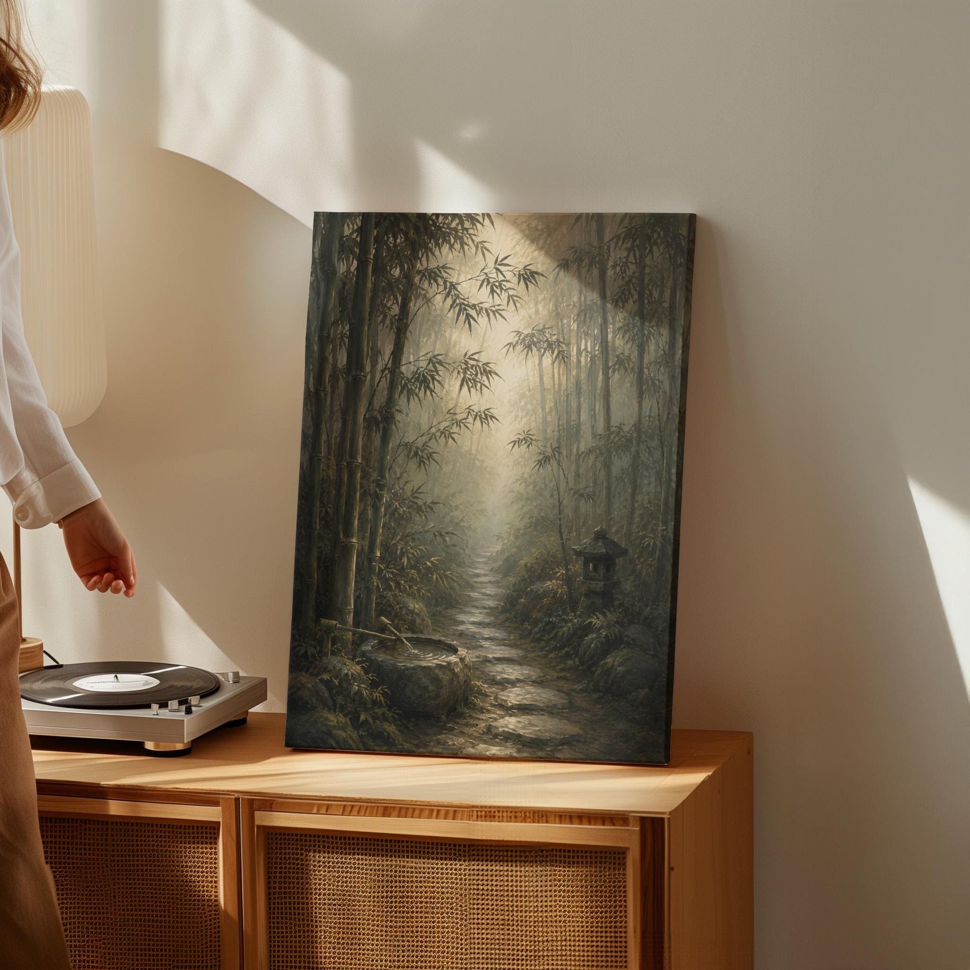 Stone path through a misty bamboo forest with a water basin, canvas print shown in a sunlit, contemporary room