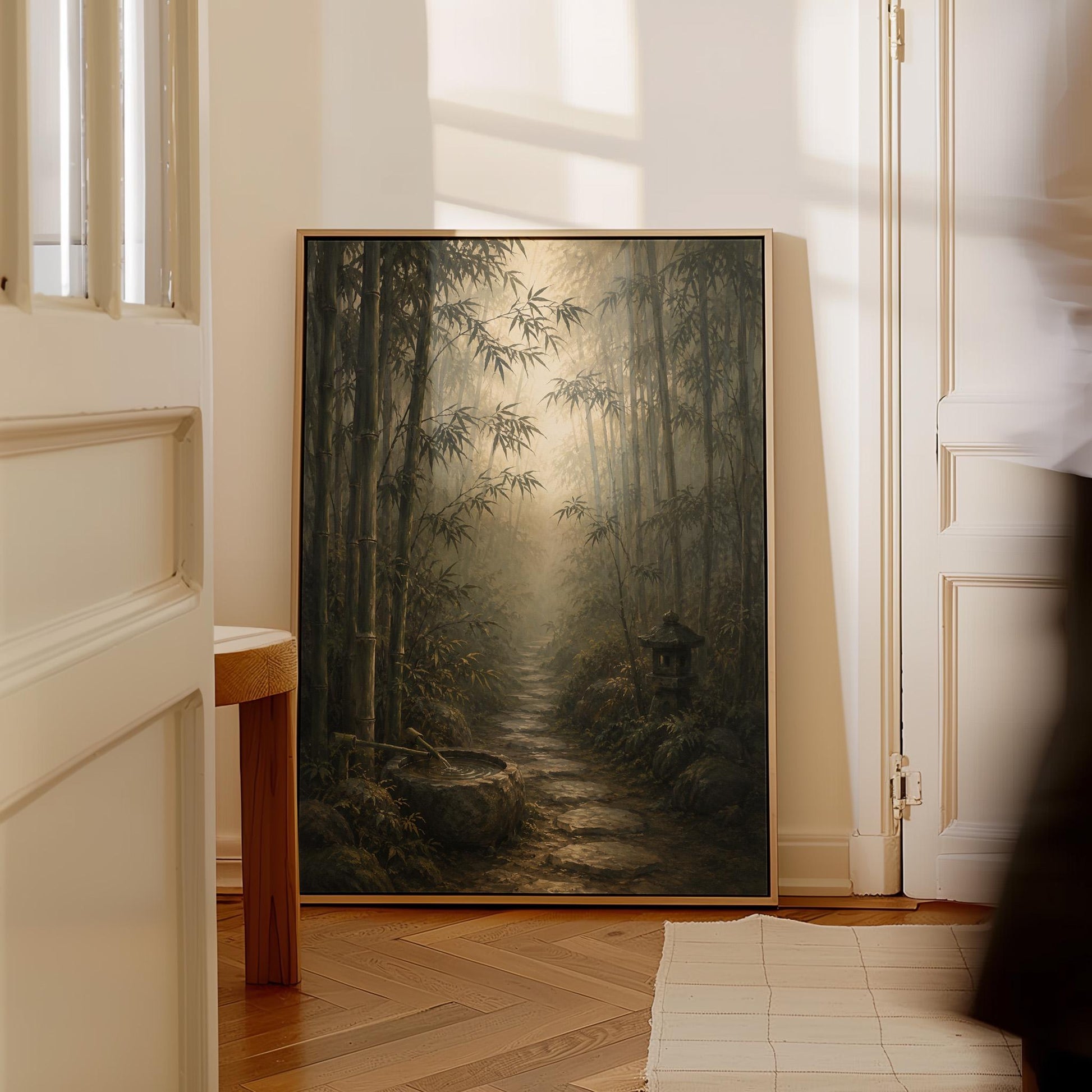 Stone path through a misty bamboo forest with a water basin, canvas wall art seen in a warm interior with natural light