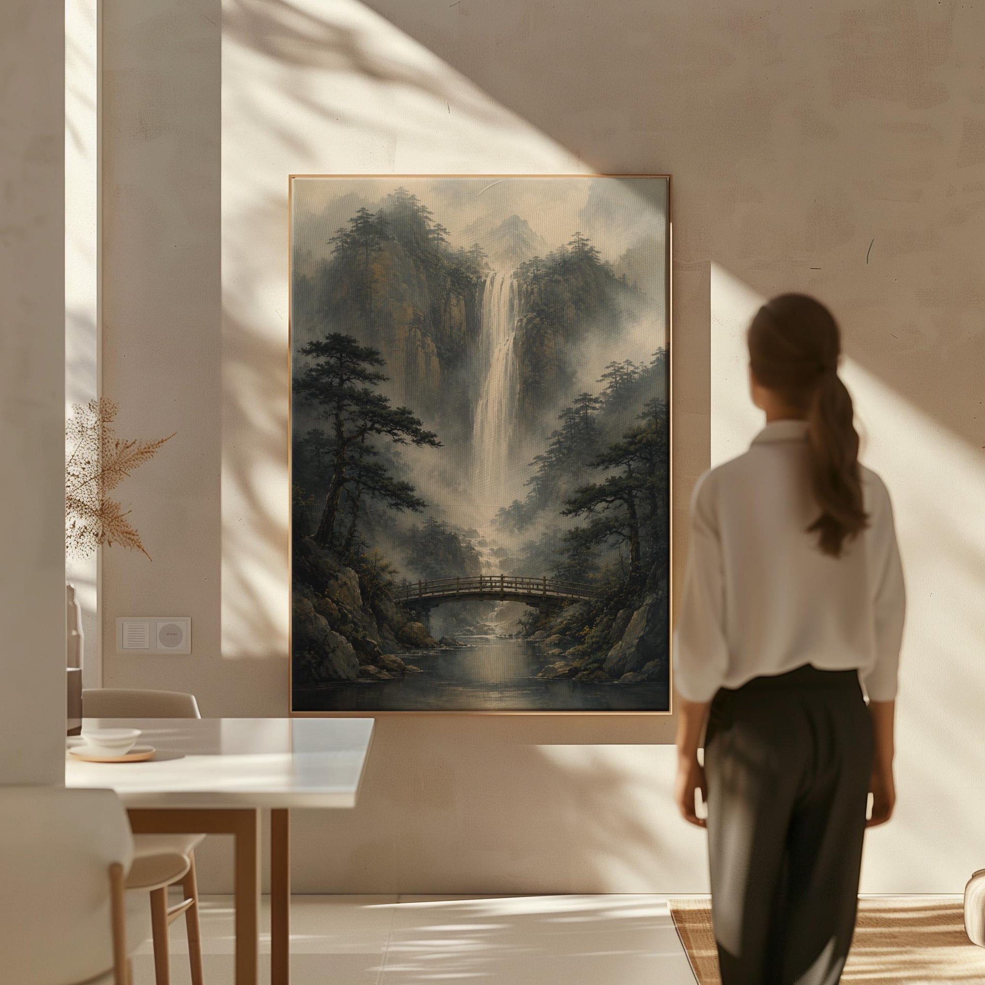 Tall waterfall and wooden bridge in a misty gorge, canvas print shown to scale in a furnished room