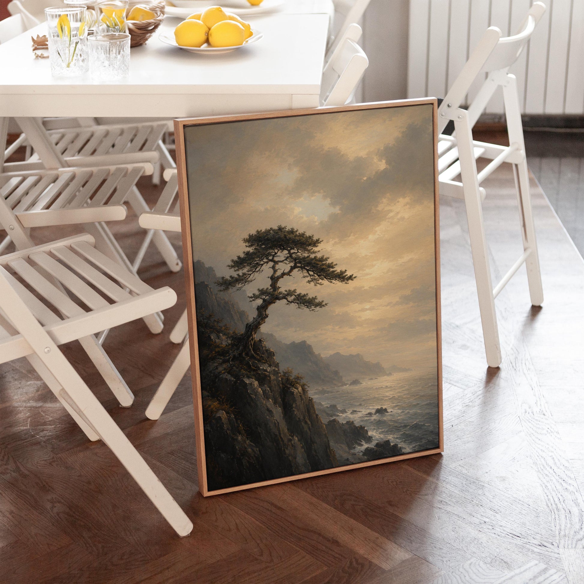 Lone pine on a sea cliff above a restless ocean, canvas print displayed on a neutral wall in a styled interior