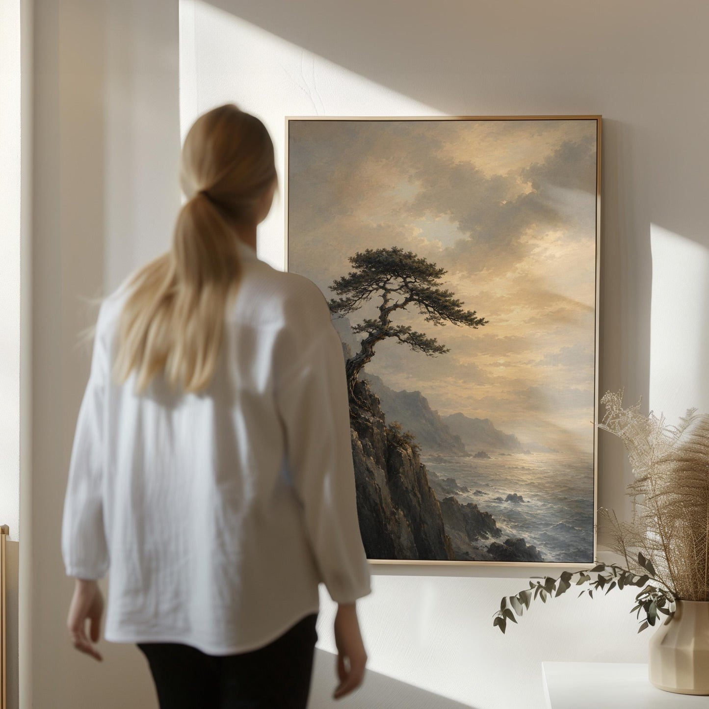 Lone pine on a sea cliff above a restless ocean, canvas wall art hanging in a calm, modern living space