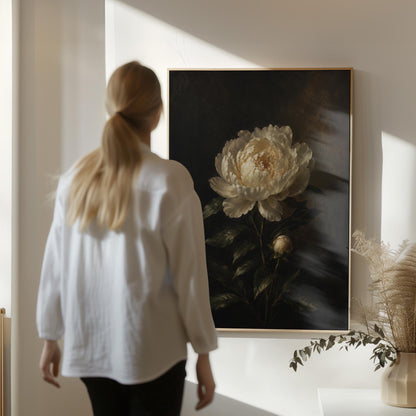 White peony in full bloom against a dark background, canvas print shown to scale in a furnished room