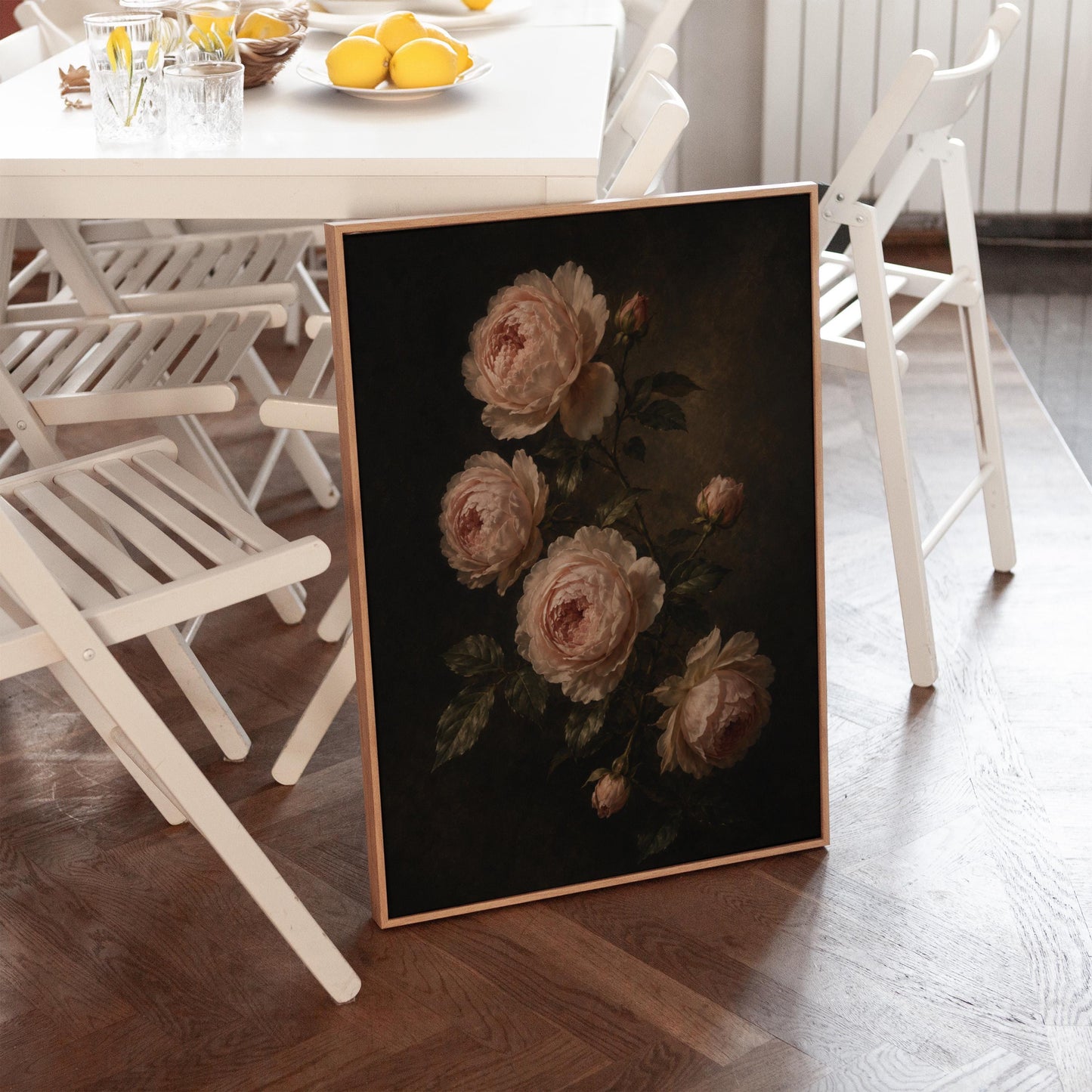 Blush pink garden roses against a dark background, canvas print on a quiet wall in a considered interior
