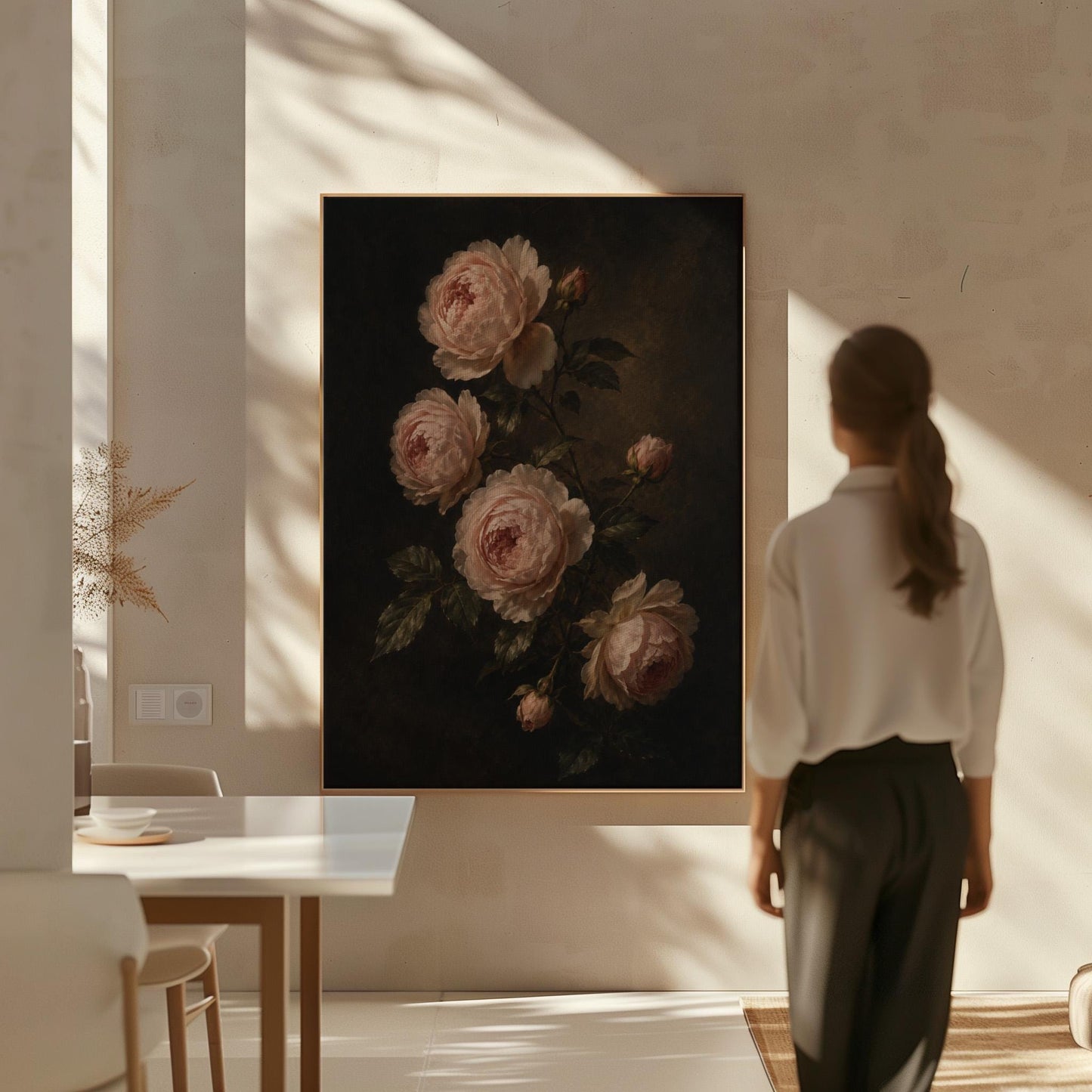 Blush pink garden roses against a dark background, canvas wall art seen in a warm interior with natural light