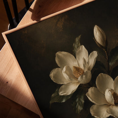 Cream magnolia blooms and dark glossy leaves, canvas print in a warm, minimally styled interior