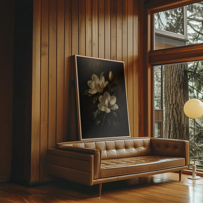 Cream magnolia blooms and dark glossy leaves, canvas wall art seen in a warm interior with natural light