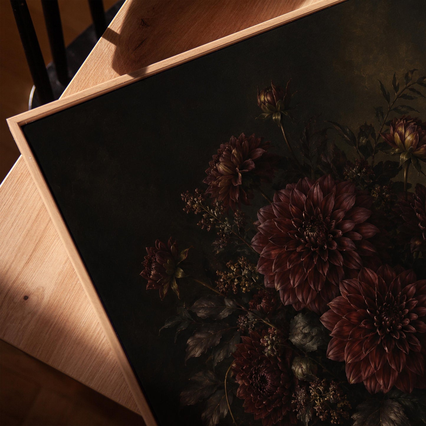 Burgundy dahlias in a brass urn against darkness, canvas print in a warm, minimally styled interior