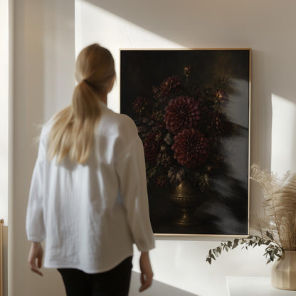 Burgundy dahlias in a brass urn against darkness, canvas print displayed on a neutral wall in a styled interior