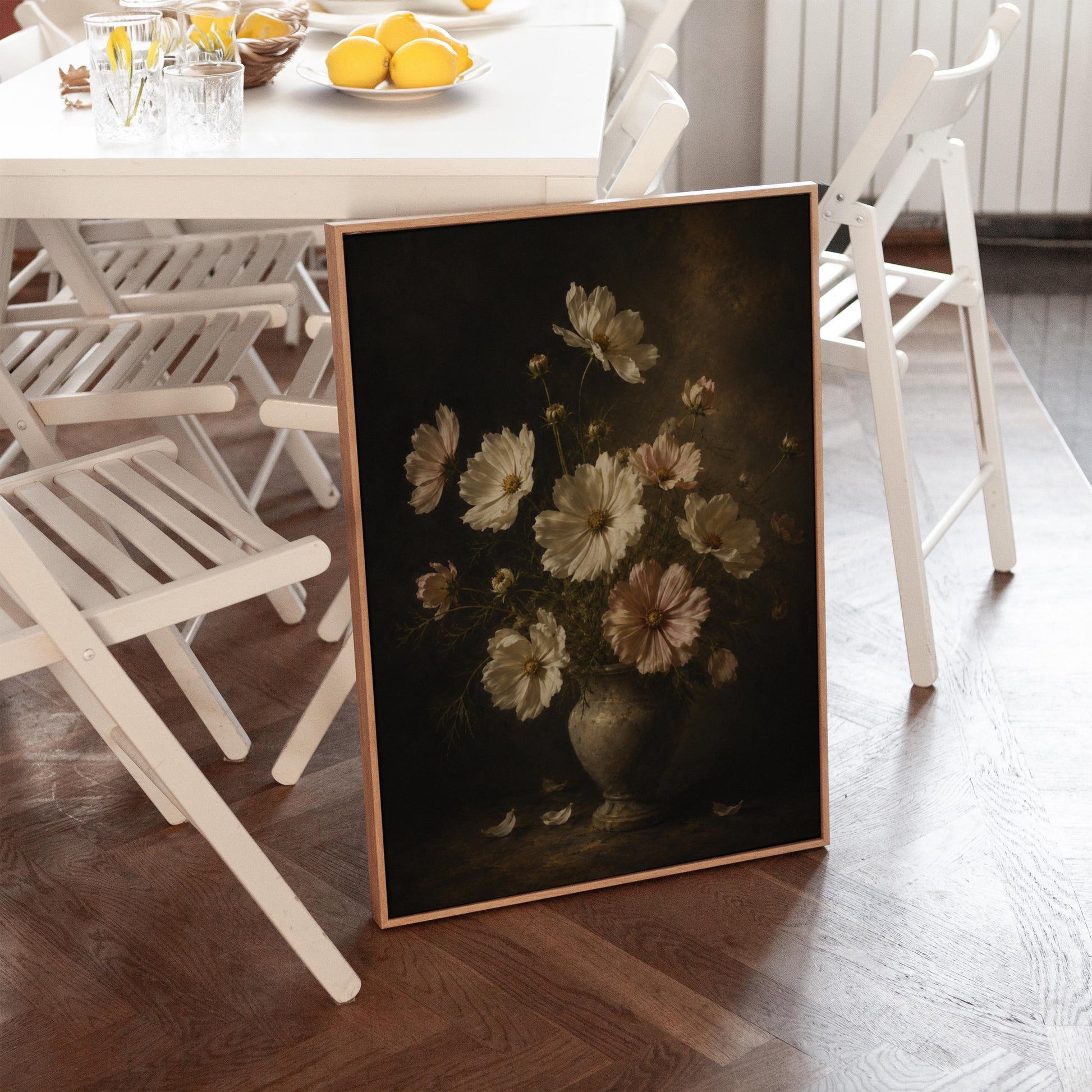 White cosmos flowers in a weathered stone vase, canvas wall art hanging in a calm, modern living space