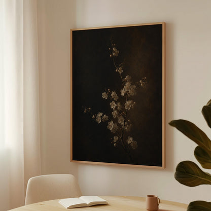 White blossom branch on a dark bronze ground, canvas wall art presented in a light, minimal room