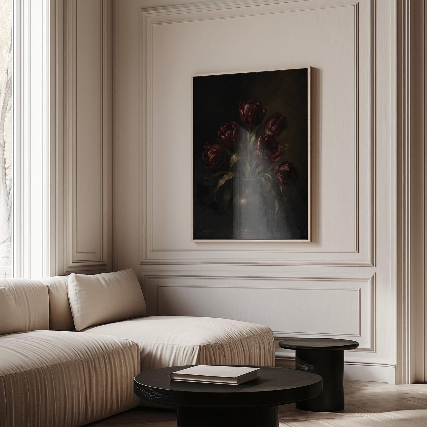 Deep burgundy tulips in a dark metal vase, canvas wall art on a quiet wall in a considered interior