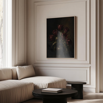 Deep burgundy tulips in a dark metal vase, canvas wall art on a quiet wall in a considered interior