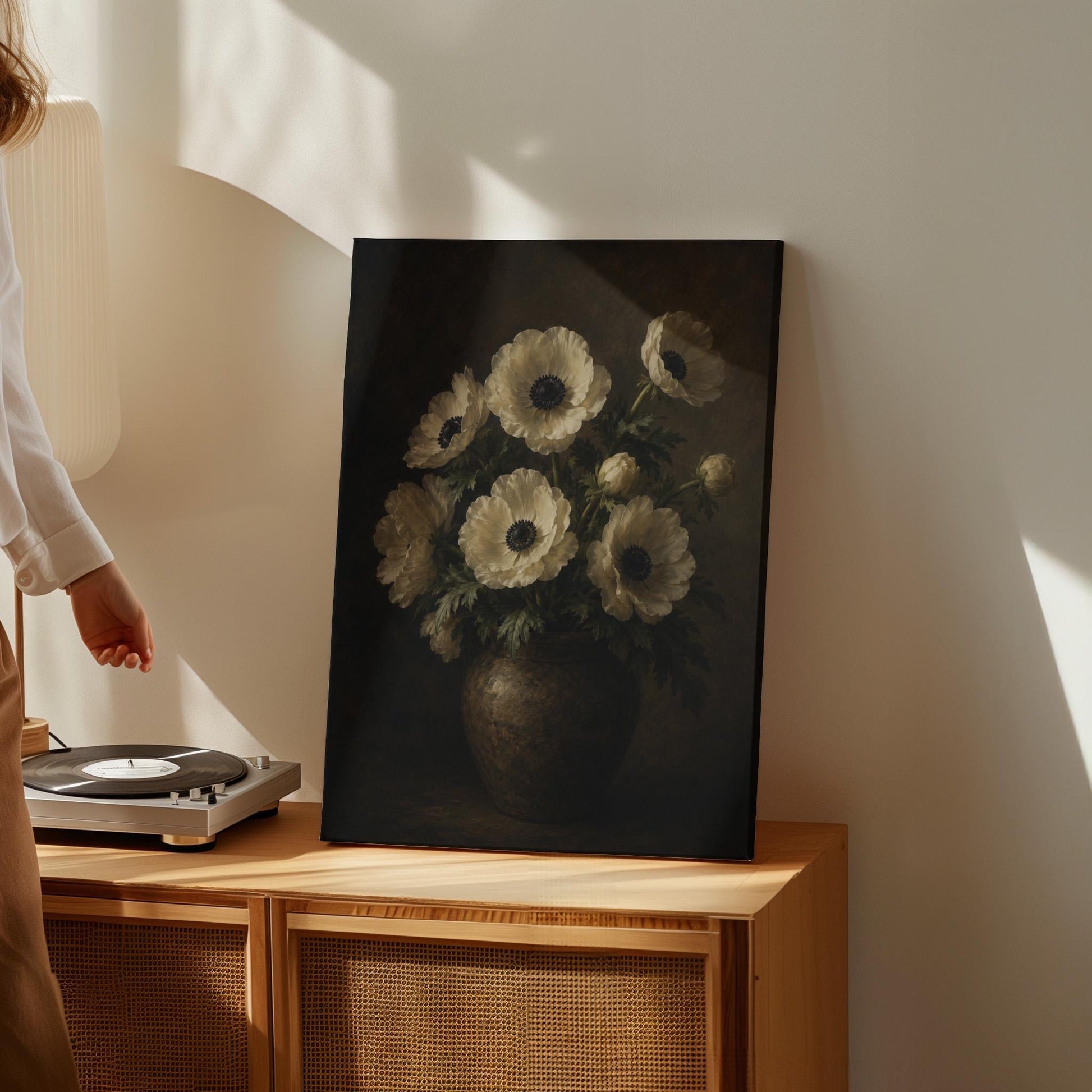 White anemones with dark centres in an earthen vase, canvas print on a quiet wall in a considered interior