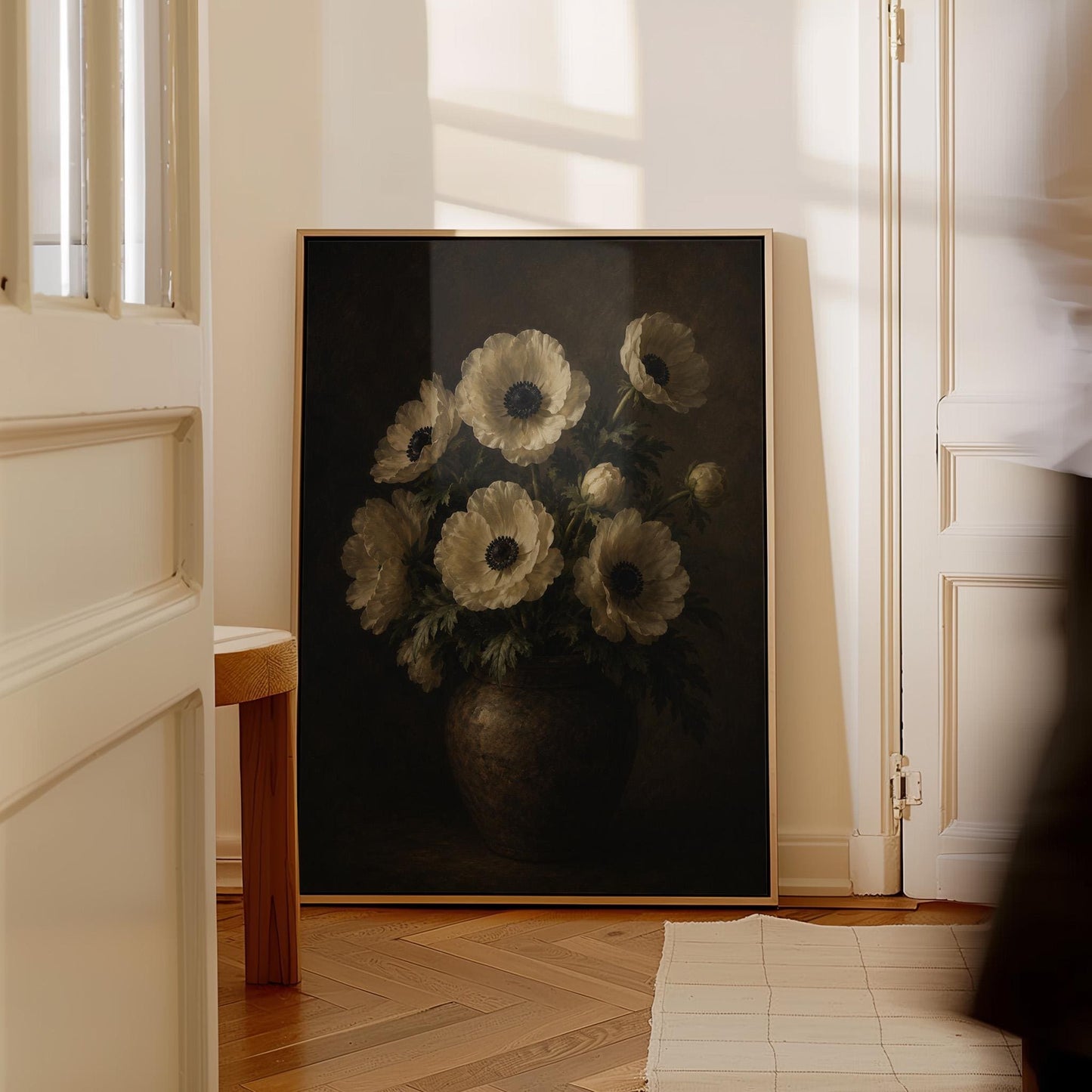 White anemones with dark centres in an earthen vase, canvas print shown to scale in a furnished room