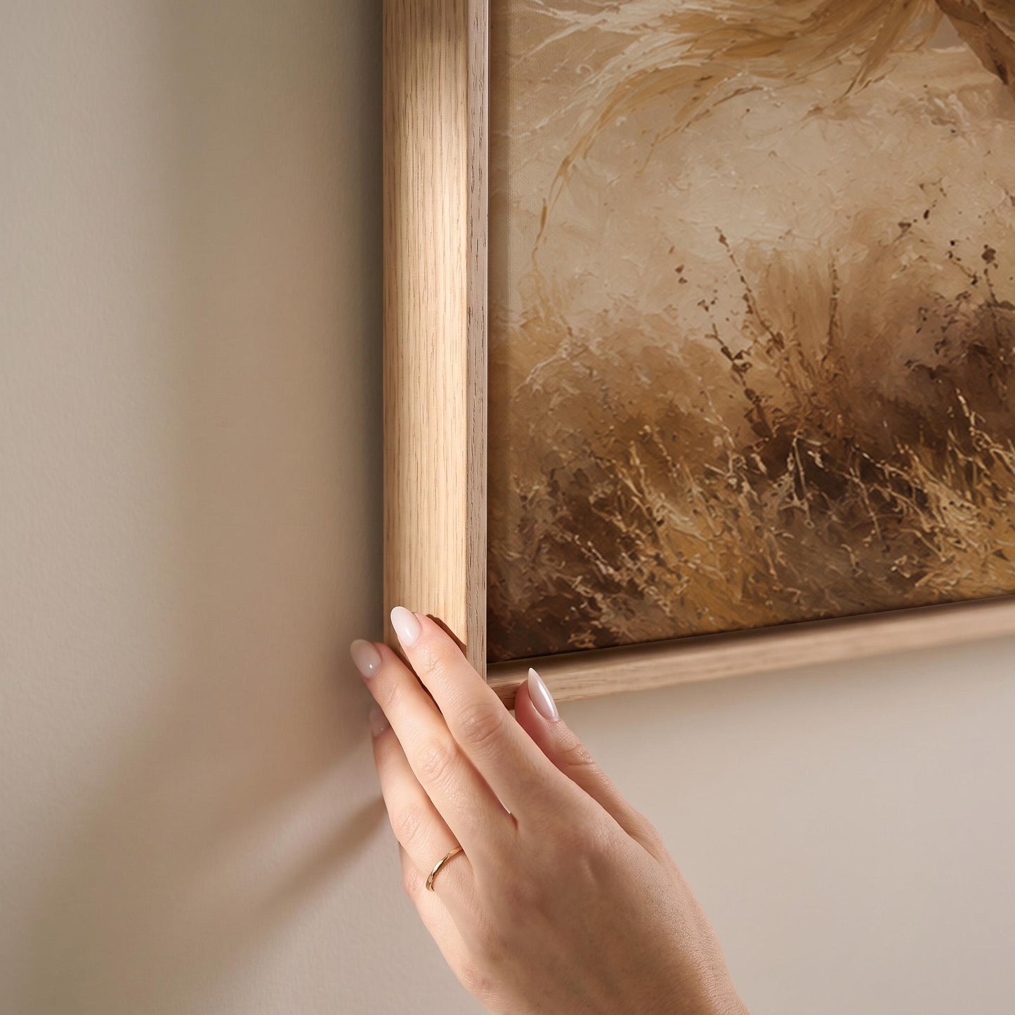 Two horses galloping side by side through golden prairie grass, canvas print shown at full size in a light-filled bedroom