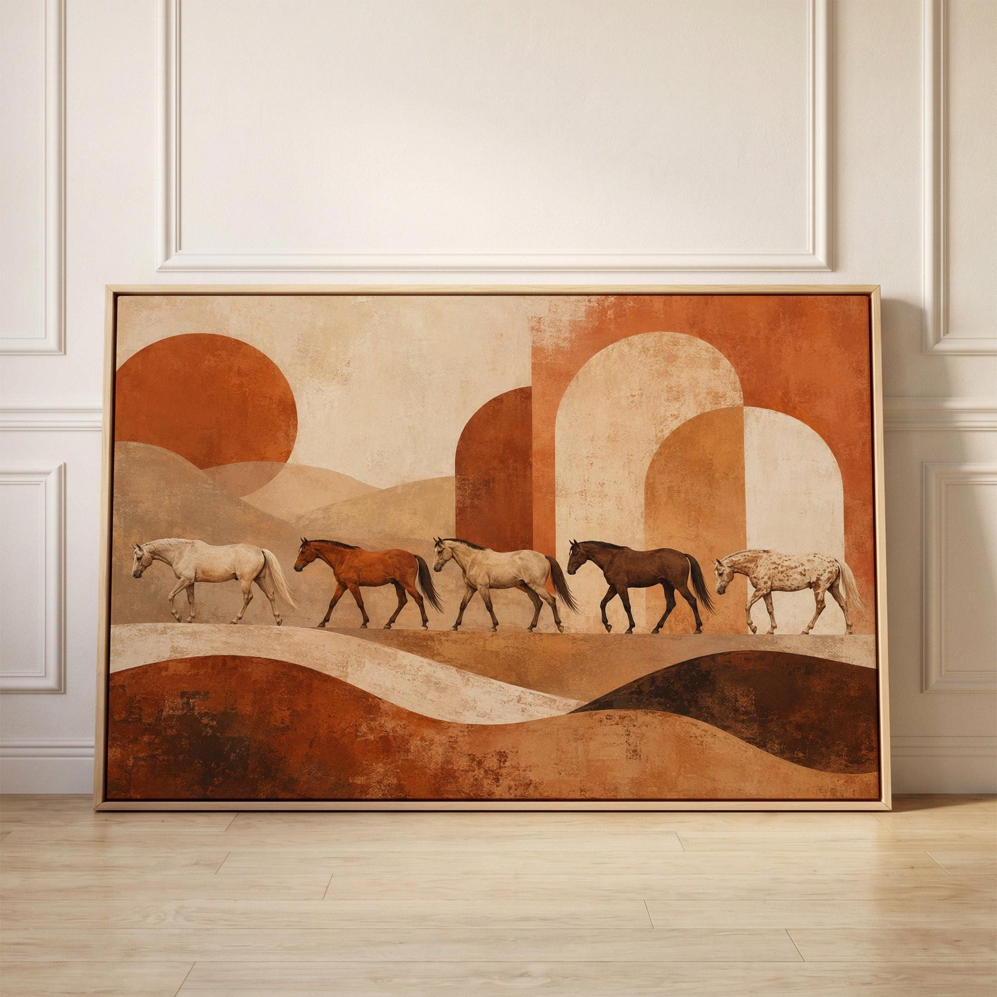 Line of horses crossing an abstract terracotta landscape, canvas print held up against a sunlit bedroom wall