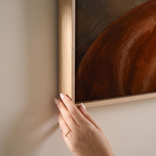Chestnut horse portrait turning its head in warm light, canvas print shown at full size in a light-filled bedroom