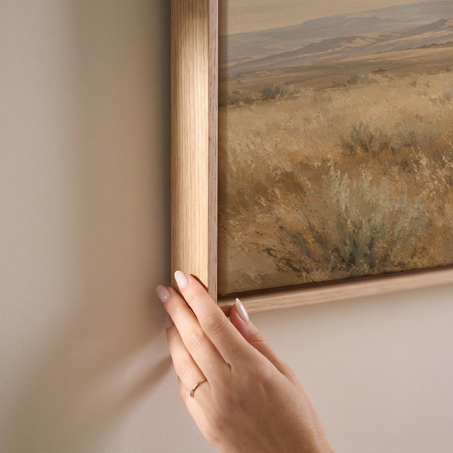 Lone white horse cantering across open prairie under a big sky, canvas print shown at full size in a light-filled bedroom