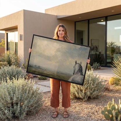 Dapple grey horse looking out over a hazy green valley, canvas print shown in a sunlit, contemporary room