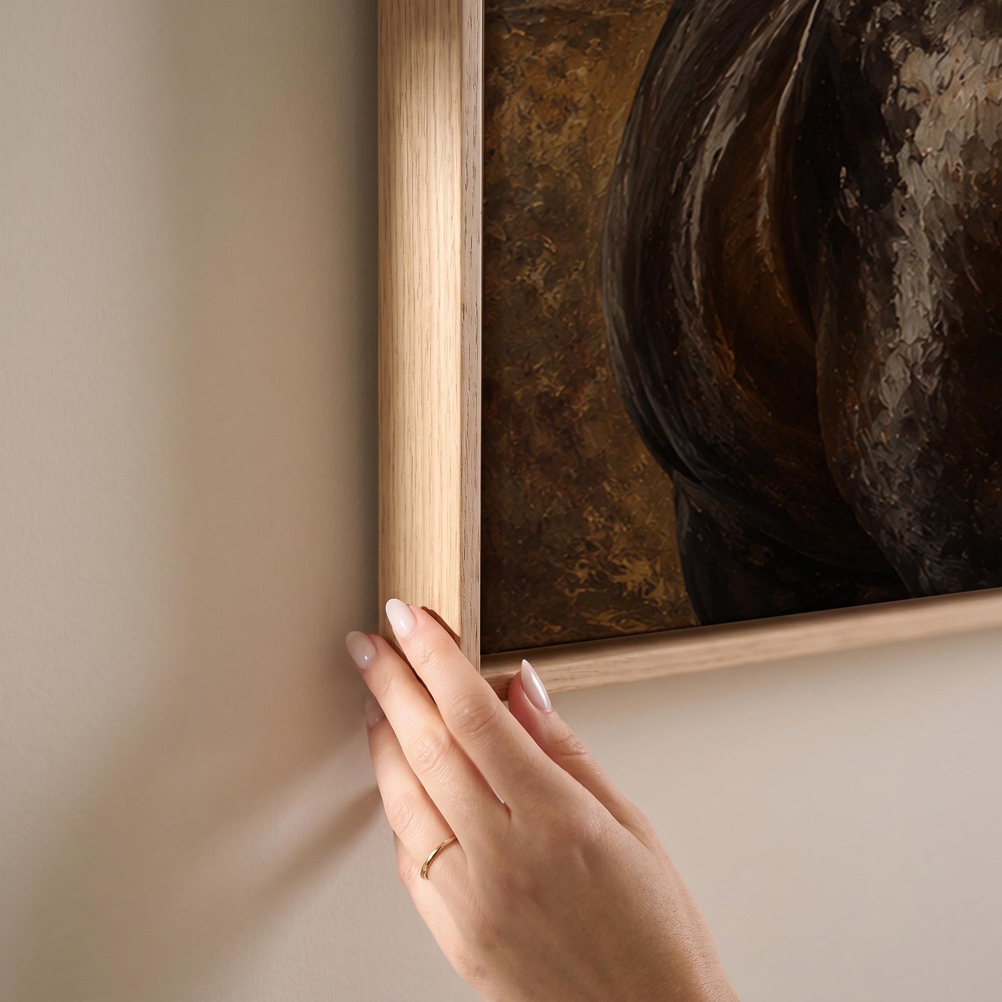 Black horse looking back against a textured gold and red ground, canvas print shown at full size in a light-filled bedroom