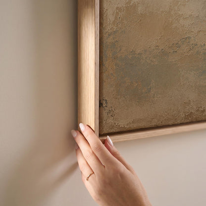 White horse seen from behind against a weathered blue and cream ground, canvas print shown at full size in a light-filled bedroom