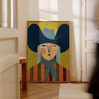 Folk cowgirl in an oversized navy hat and blue neckerchief on mustard, canvas wall art hanging in a calm, modern living space