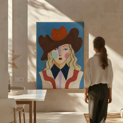Blonde cowgirl in a rust cowboy hat with a cubist face on deep blue, canvas print shown to scale in a furnished room