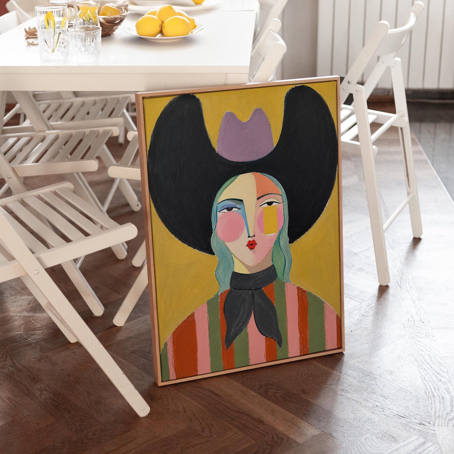 Folk cowgirl with teal hair, a big black hat and striped shirt on golden yellow, canvas print seen in a warm interior with natural light