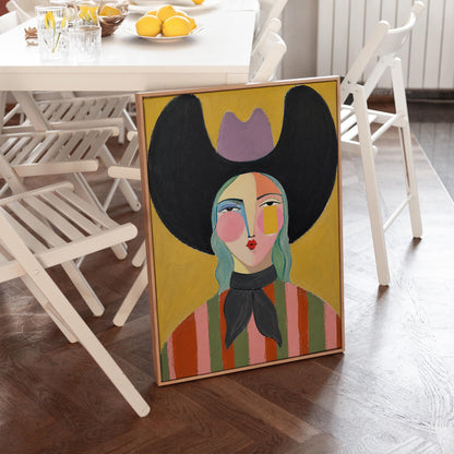 Folk cowgirl with teal hair, a big black hat and striped shirt on golden yellow, canvas print seen in a warm interior with natural light