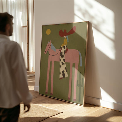 Cowgirl in a red hat riding a long-legged pink horse past a cactus at sunset, canvas print on a quiet wall in a considered interior