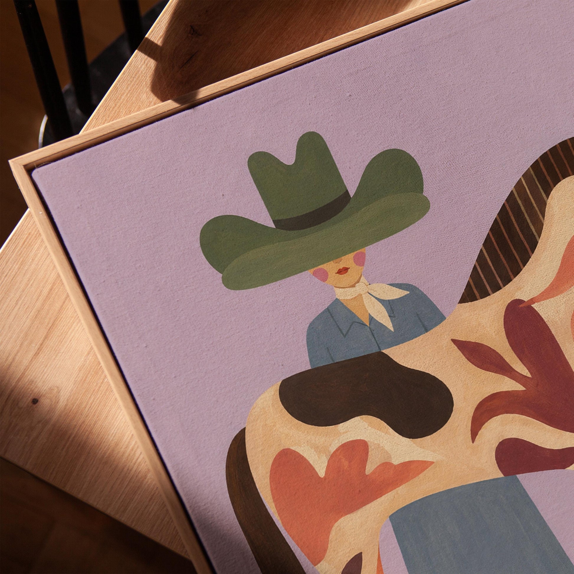 Cowgirl in a green hat beside a tall patterned horse on soft lilac, canvas print in a warm, minimally styled interior