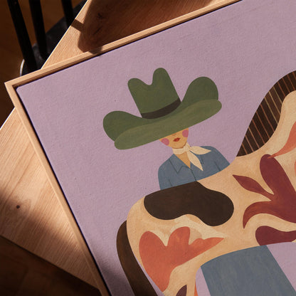 Cowgirl in a green hat beside a tall patterned horse on soft lilac, canvas print in a warm, minimally styled interior