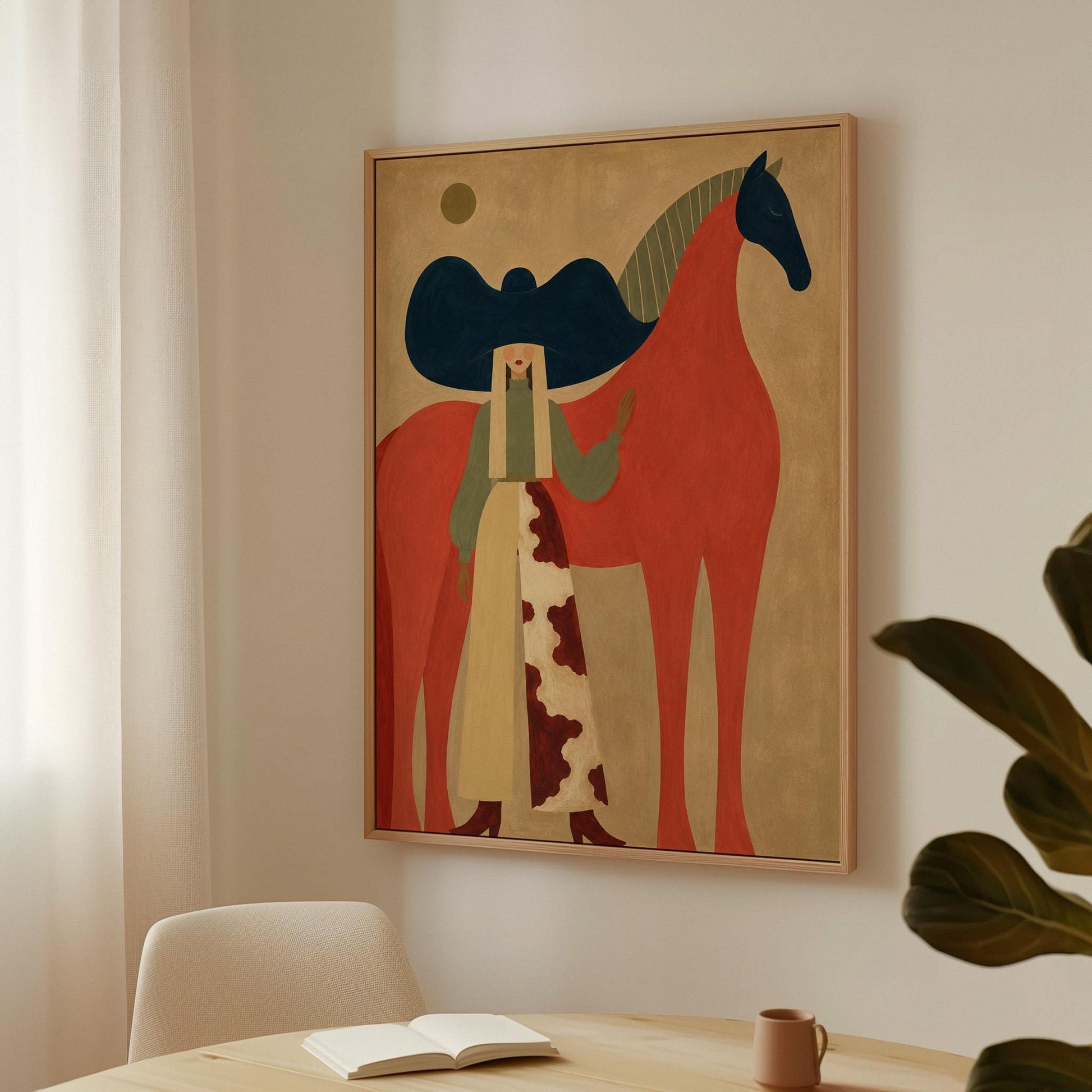 Woman in a big navy hat standing before a bright red horse on warm ochre, canvas print shown to scale in a furnished room