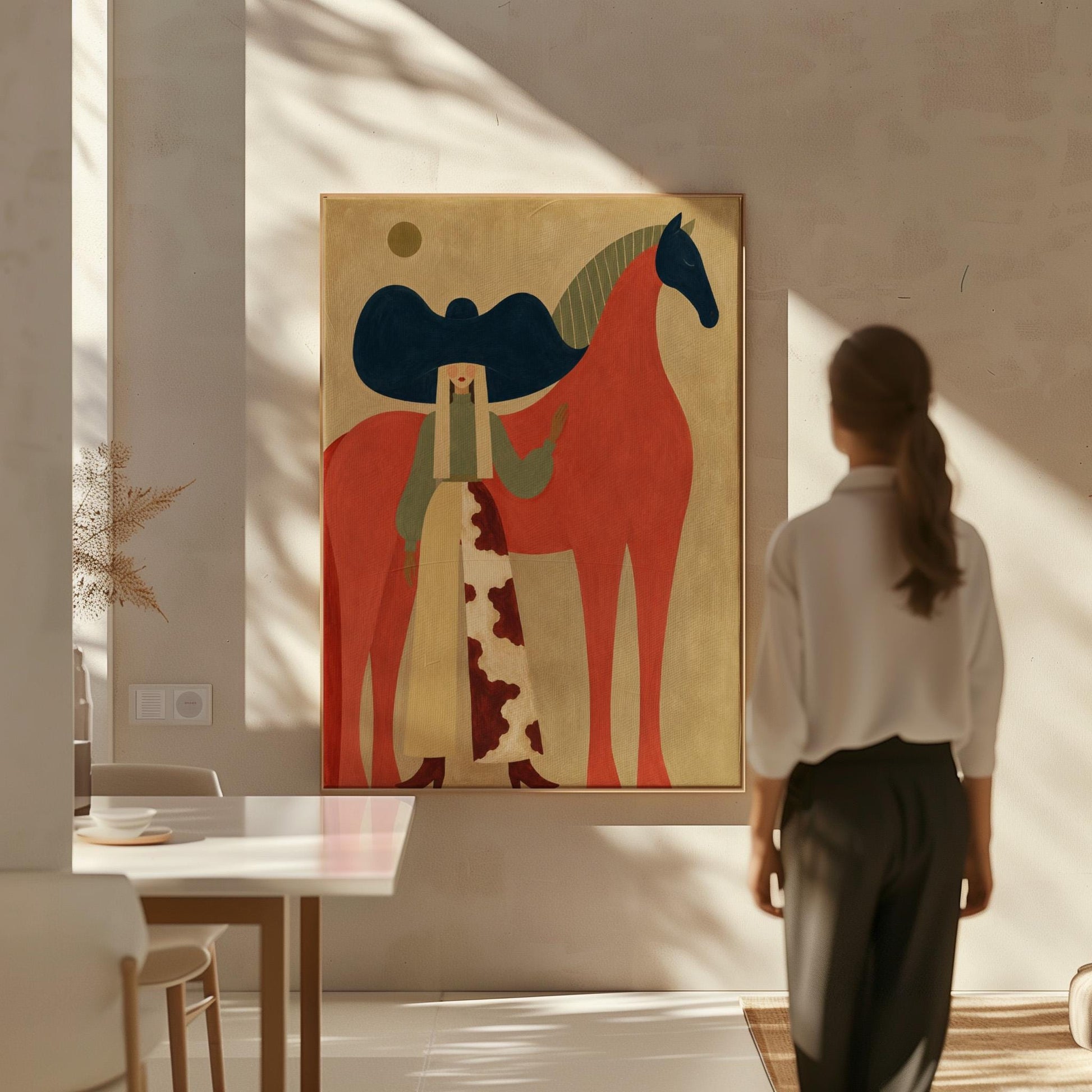 Woman in a big navy hat standing before a bright red horse on warm ochre, canvas print hanging in a calm, modern living space