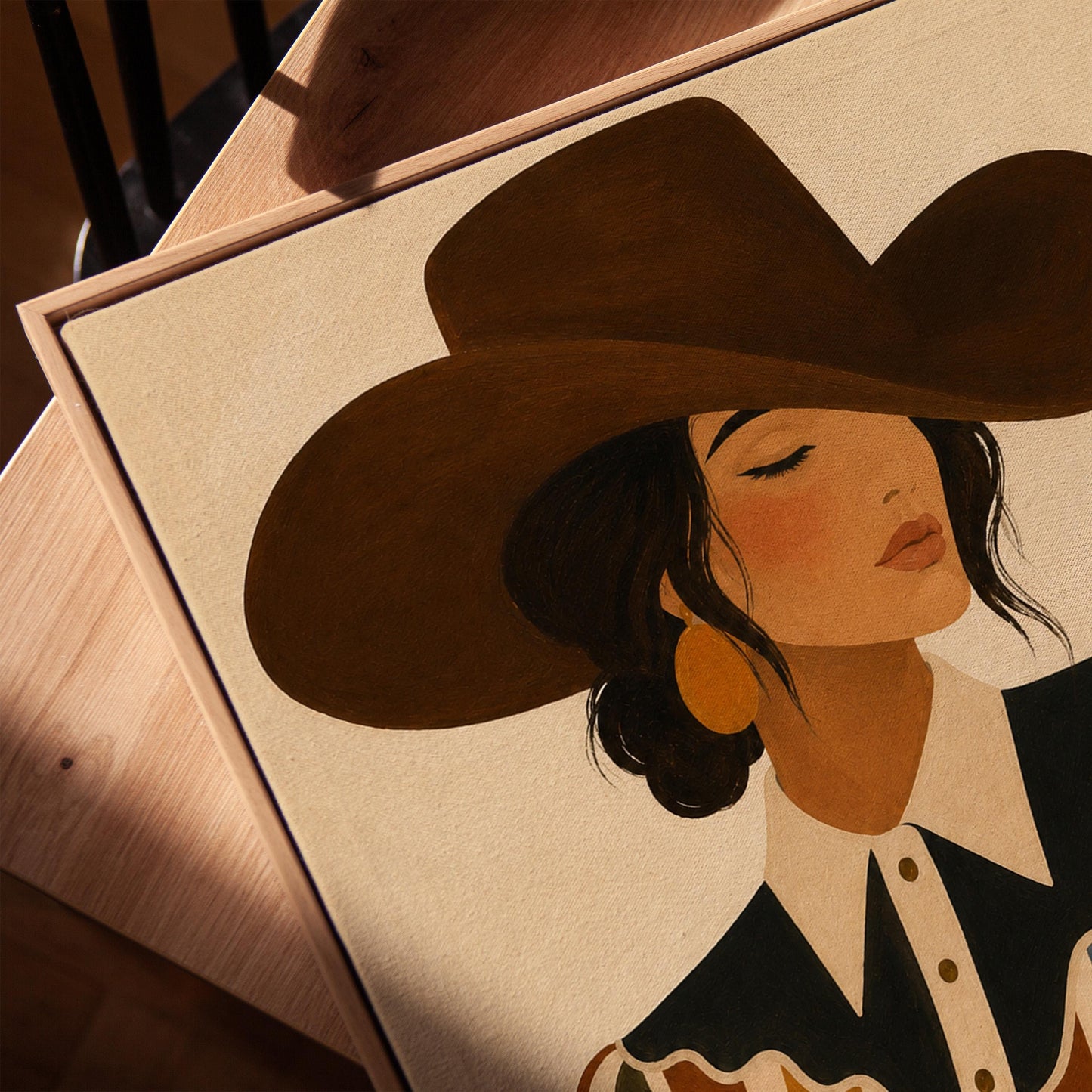 Cowgirl in a brown hat and rippling striped blouse with a black collar on cream, canvas print in a warm, minimally styled interior