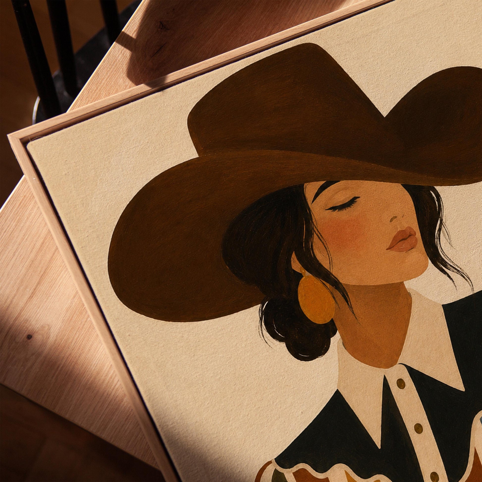 Cowgirl in a brown hat and rippling striped blouse with a black collar on cream, canvas print in a warm, minimally styled interior