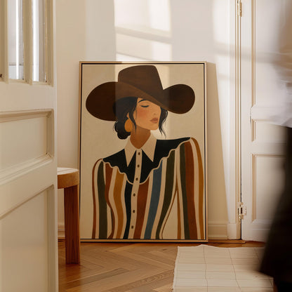 Cowgirl in a brown hat and rippling striped blouse with a black collar on cream, canvas print displayed on a neutral wall in a styled interior