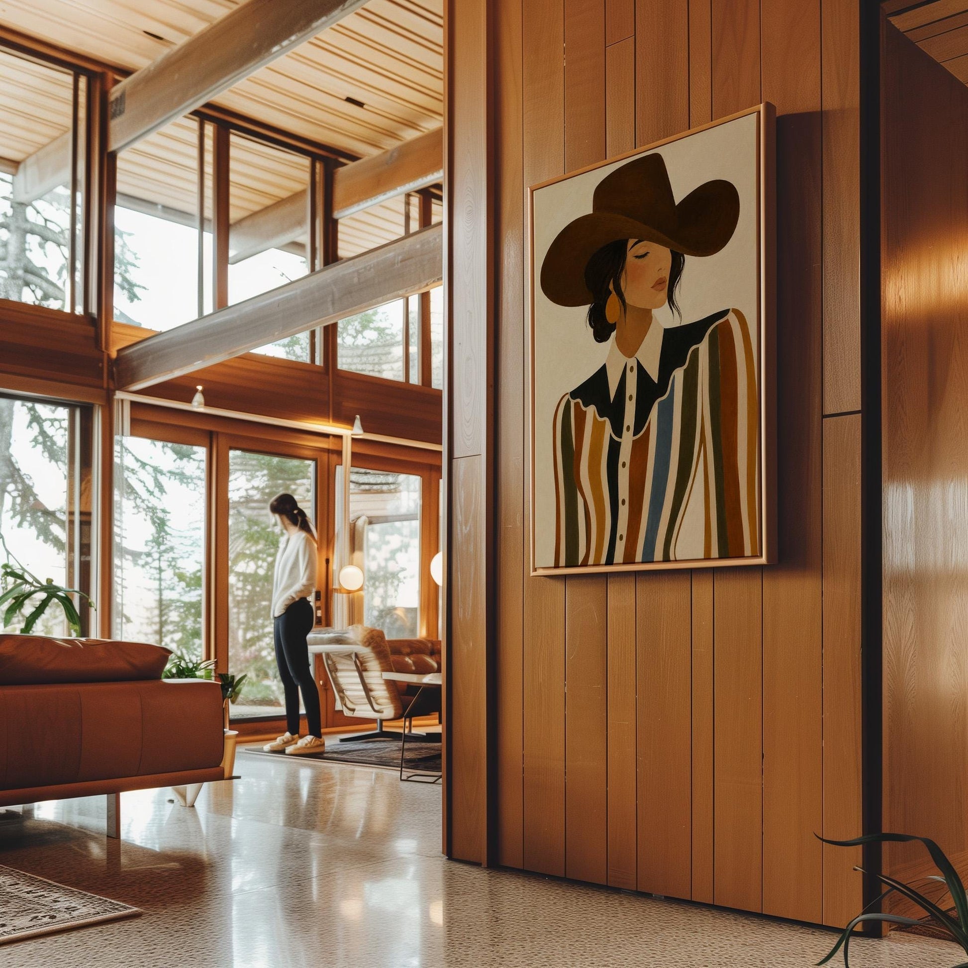 Cowgirl in a brown hat and rippling striped blouse with a black collar on cream, canvas wall art hanging in a calm, modern living space