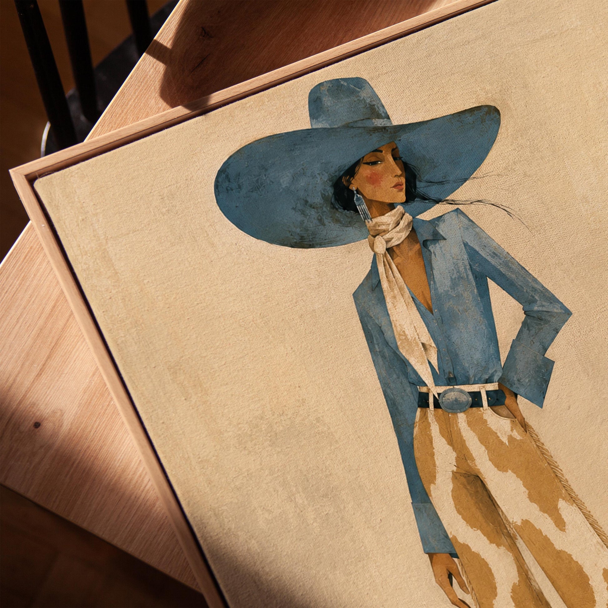 Full-figure cowgirl in a blue hat, denim shirt and cow-print flared pants on cream, canvas print in a warm, minimally styled interior