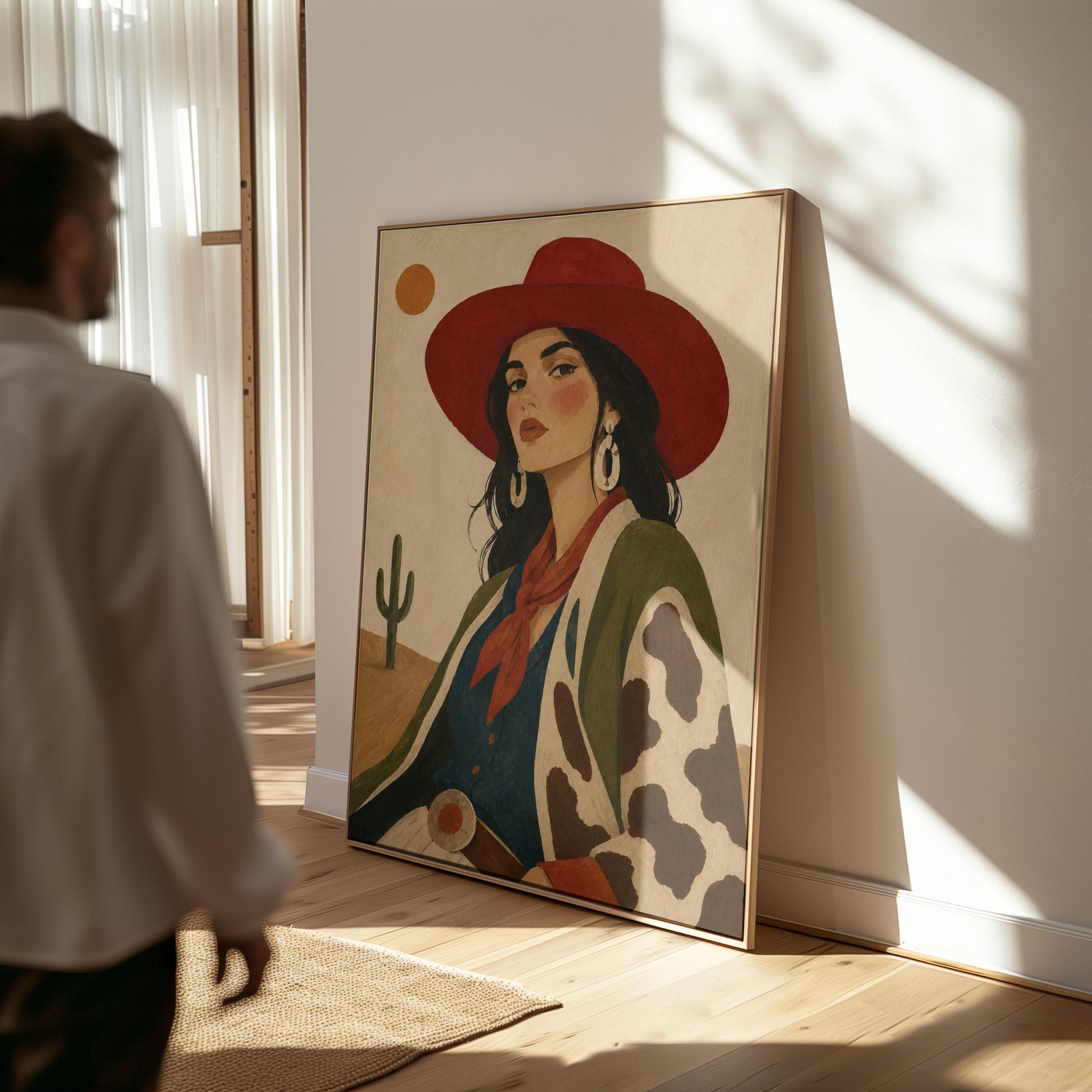 Dark-haired cowgirl in a red hat and cow-print jacket before a desert cactus, canvas print seen in a warm interior with natural light
