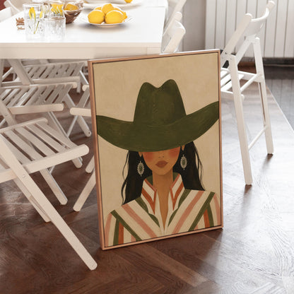 Cowgirl under a deep green hat with concho earrings and a striped western shirt, canvas wall art presented in a light, minimal room