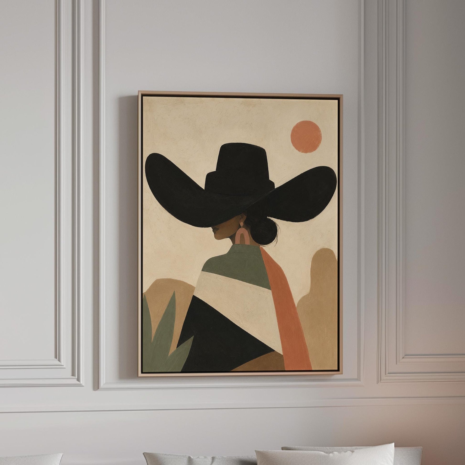 Cowgirl seen from behind in a large black hat and serape under a desert sun, canvas print in a bright room with natural daylight