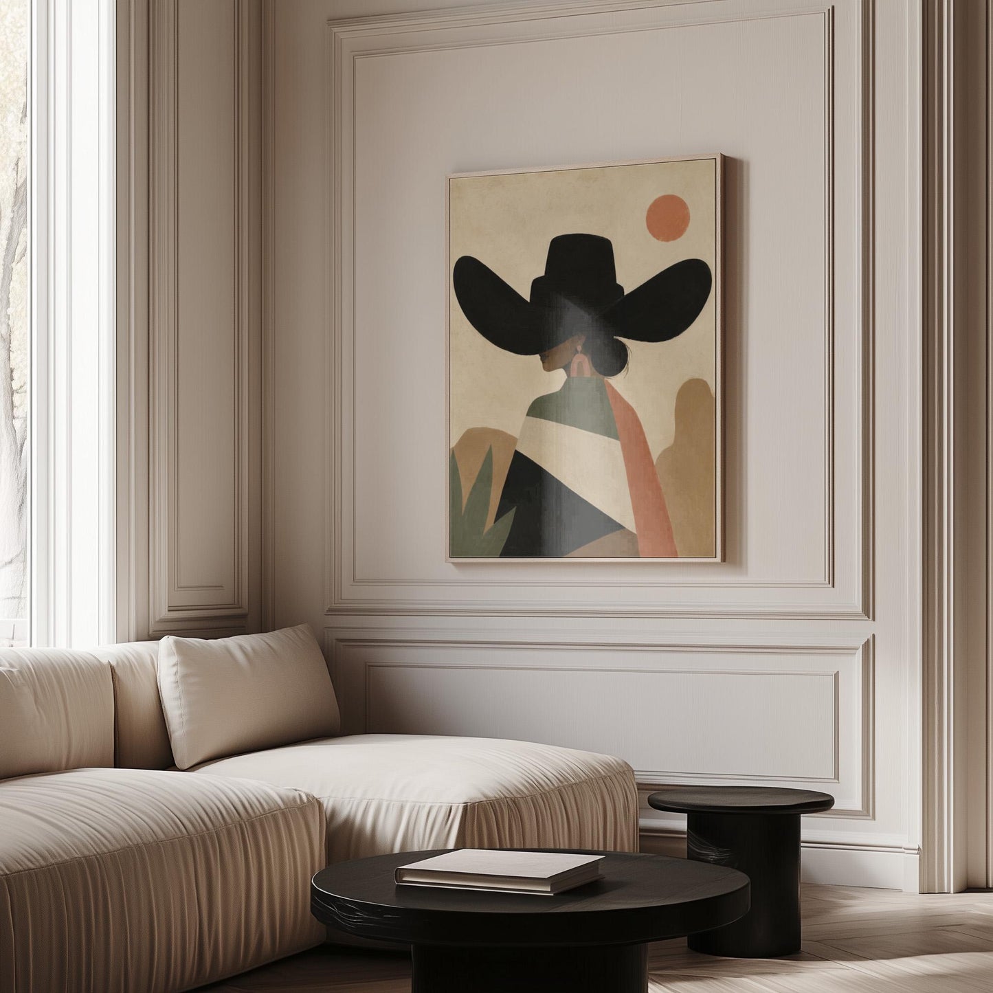 Cowgirl seen from behind in a large black hat and serape under a desert sun, canvas print shown to scale in a furnished room