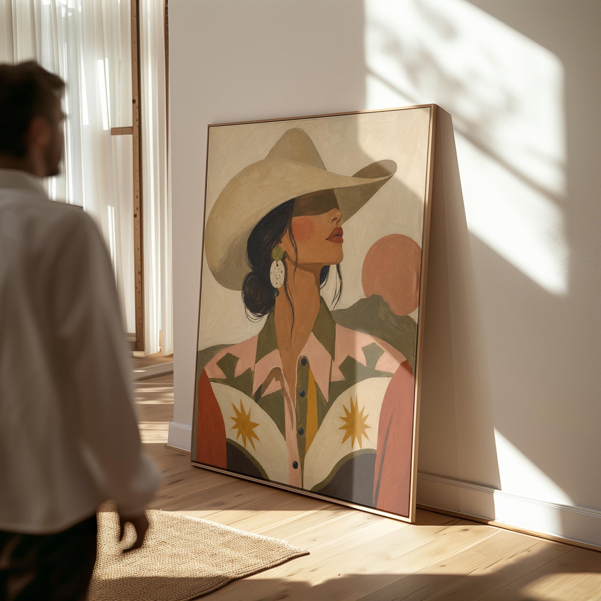Cowgirl in profile in a cream hat and star-trimmed rodeo shirt by pink mountains, canvas print styled against a soft white wall