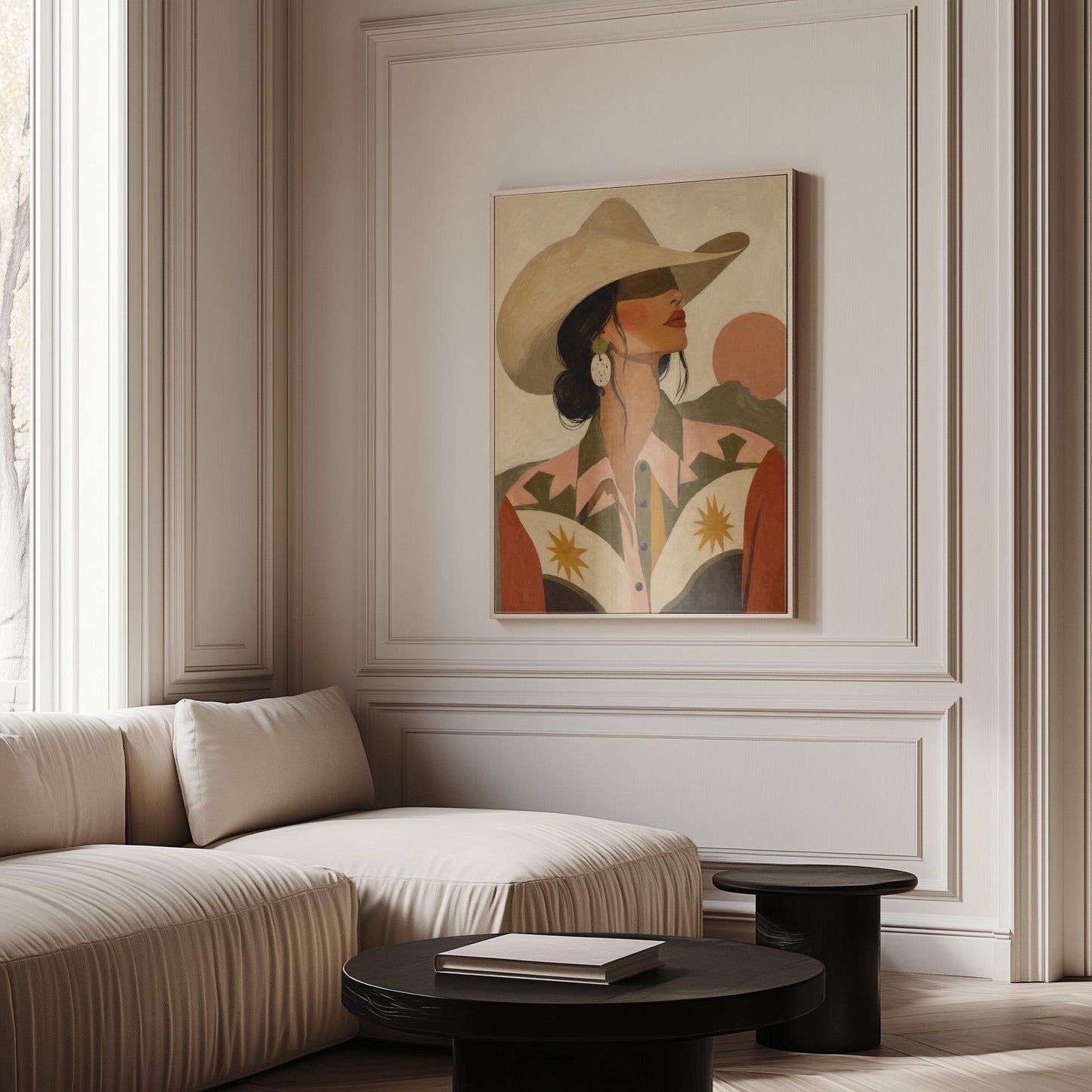 Cowgirl in profile in a cream hat and star-trimmed rodeo shirt by pink mountains, canvas print seen in a warm interior with natural light